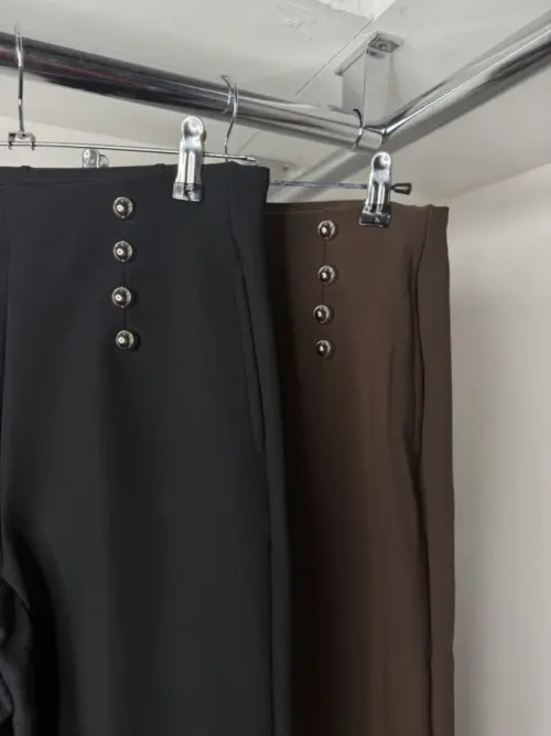 suit trousers hangung up up close