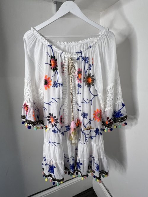 floral tunic top hanging up