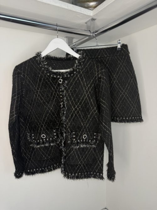 black chanel look cardigan and skirt