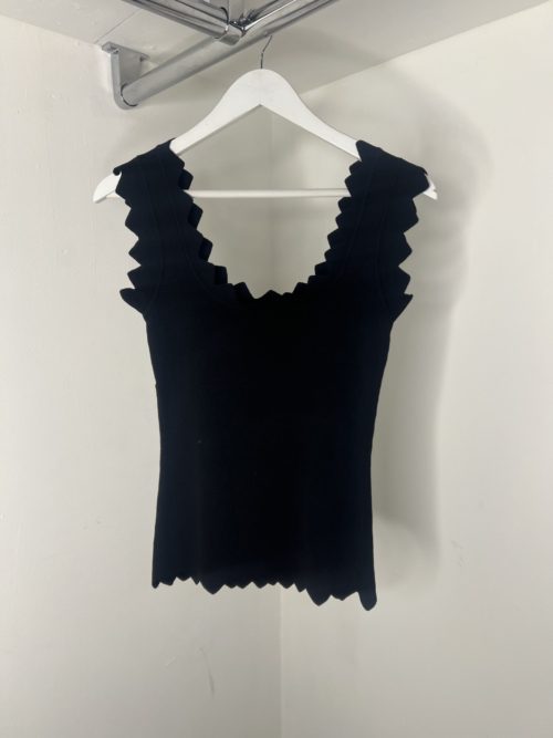 black zigzag vest