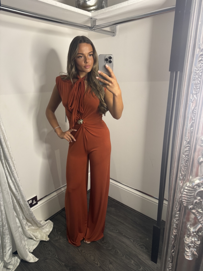 Deep V Neck Jumpsuit With Gold Broach And Tie Neck Detail - Image 3